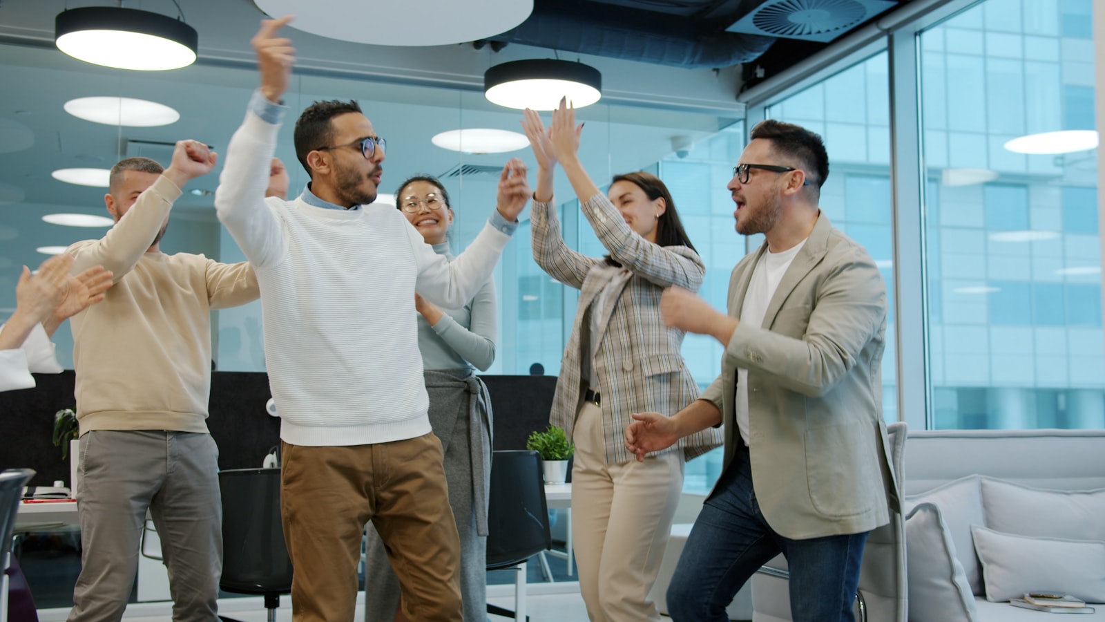 Team celebrating a successful product launch in the office