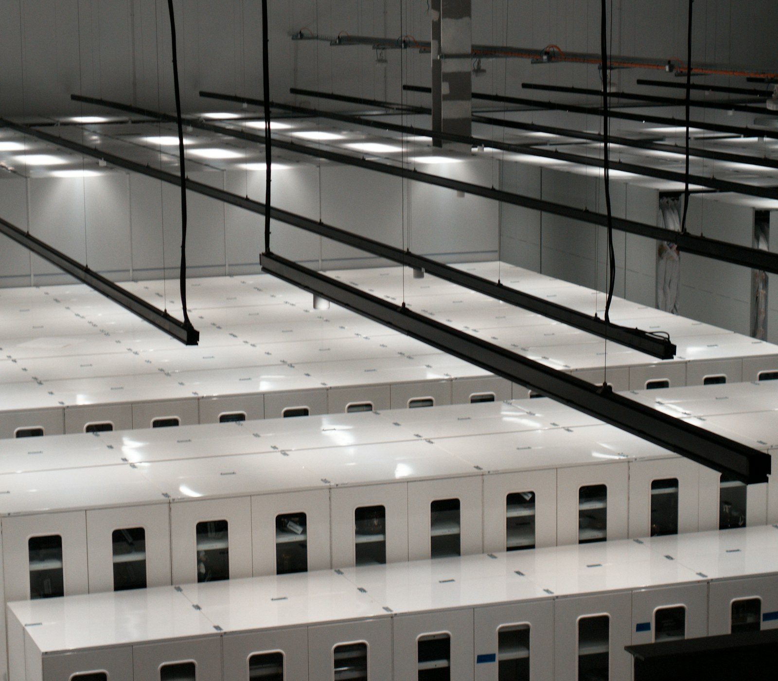 Rows of illuminated server cabinets in a modern data center, representing SMTPmart's SMTP server infrastructure